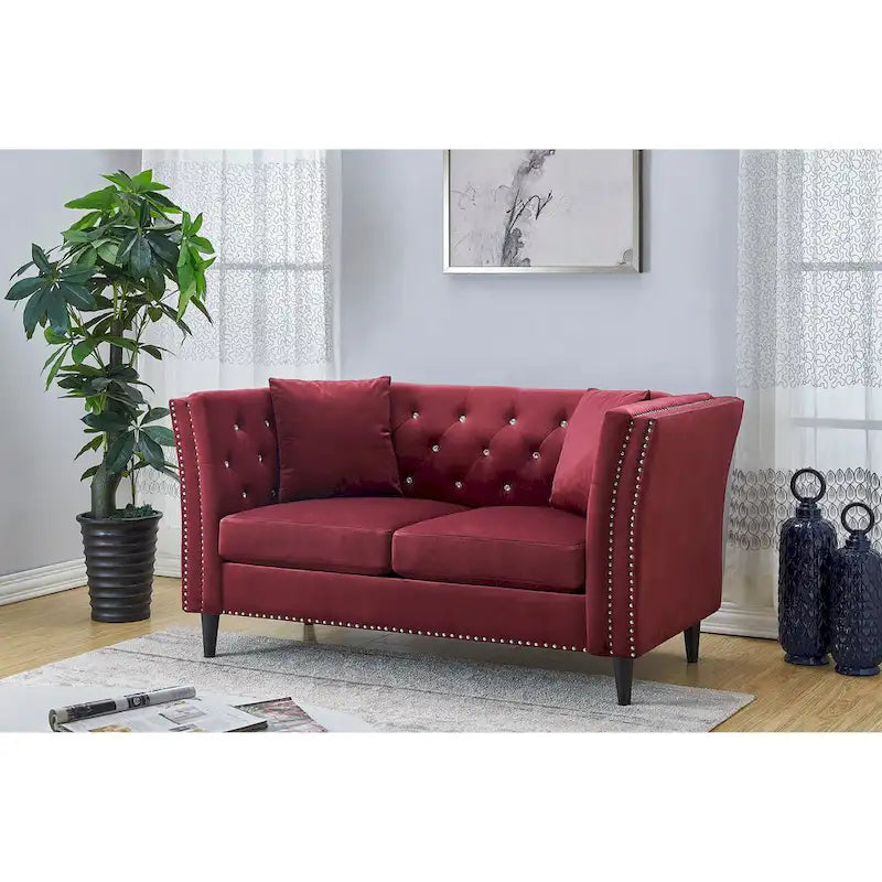 Causeuse en velours capitonné avec pieds en bois et coussins décoratifs